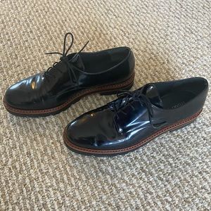 Stuart Weitzman black patent leather oxfords